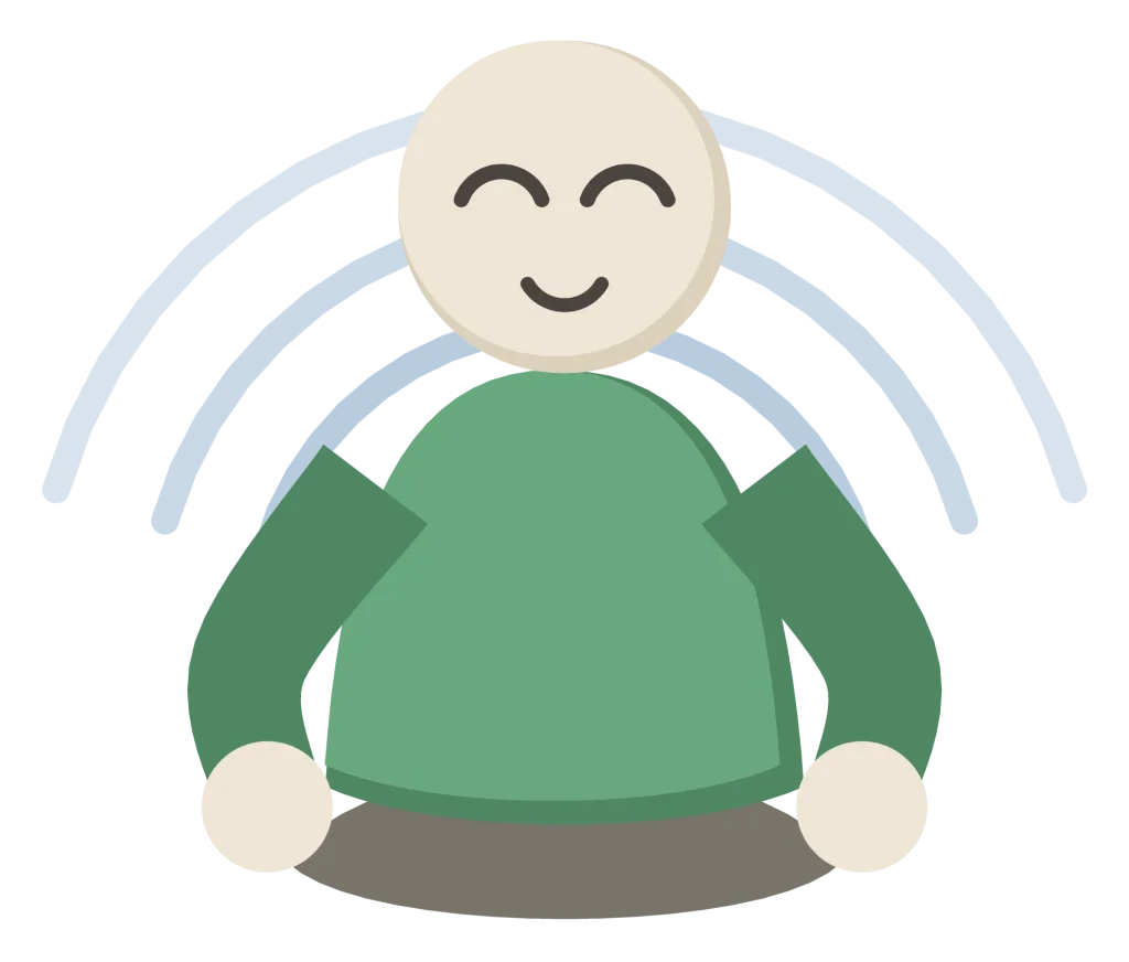 A person sitting cross-legged with their hands resting on their knees and their eyes closed.