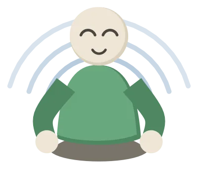 A person sitting cross-legged with their hands resting on their knees and their eyes closed.