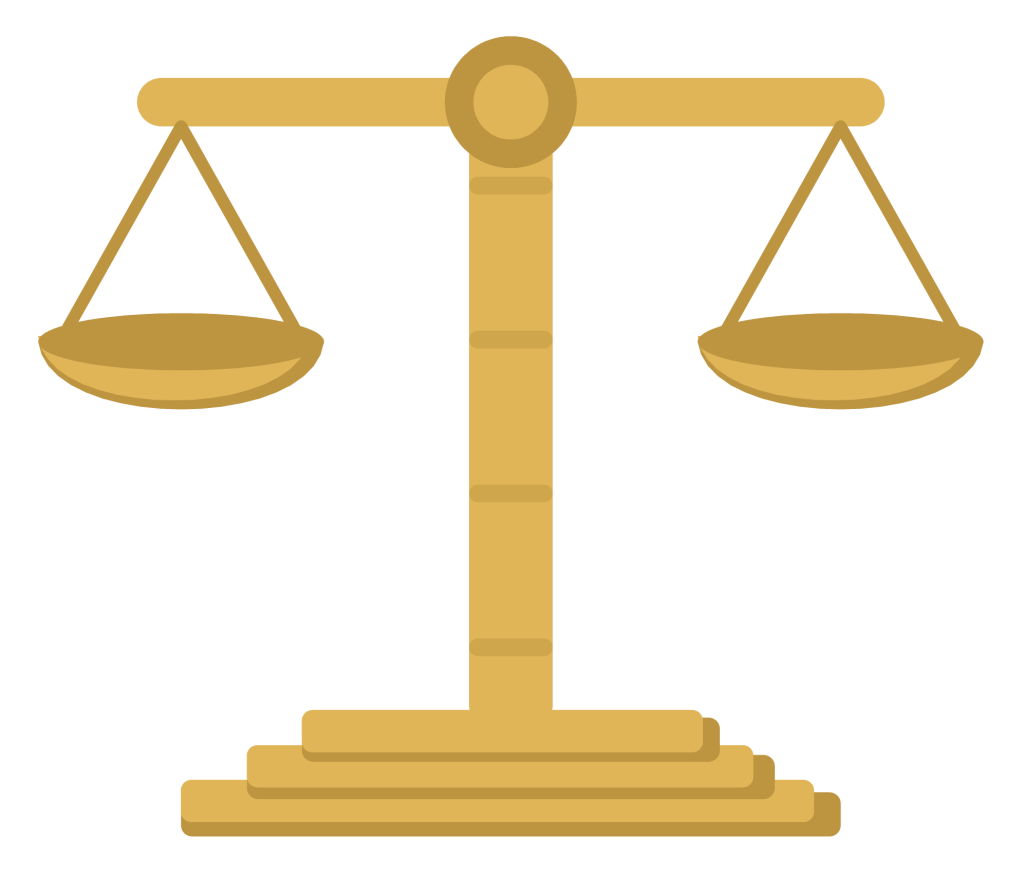 A brass balance with two pans hanging level from a central column on a stepped base.
