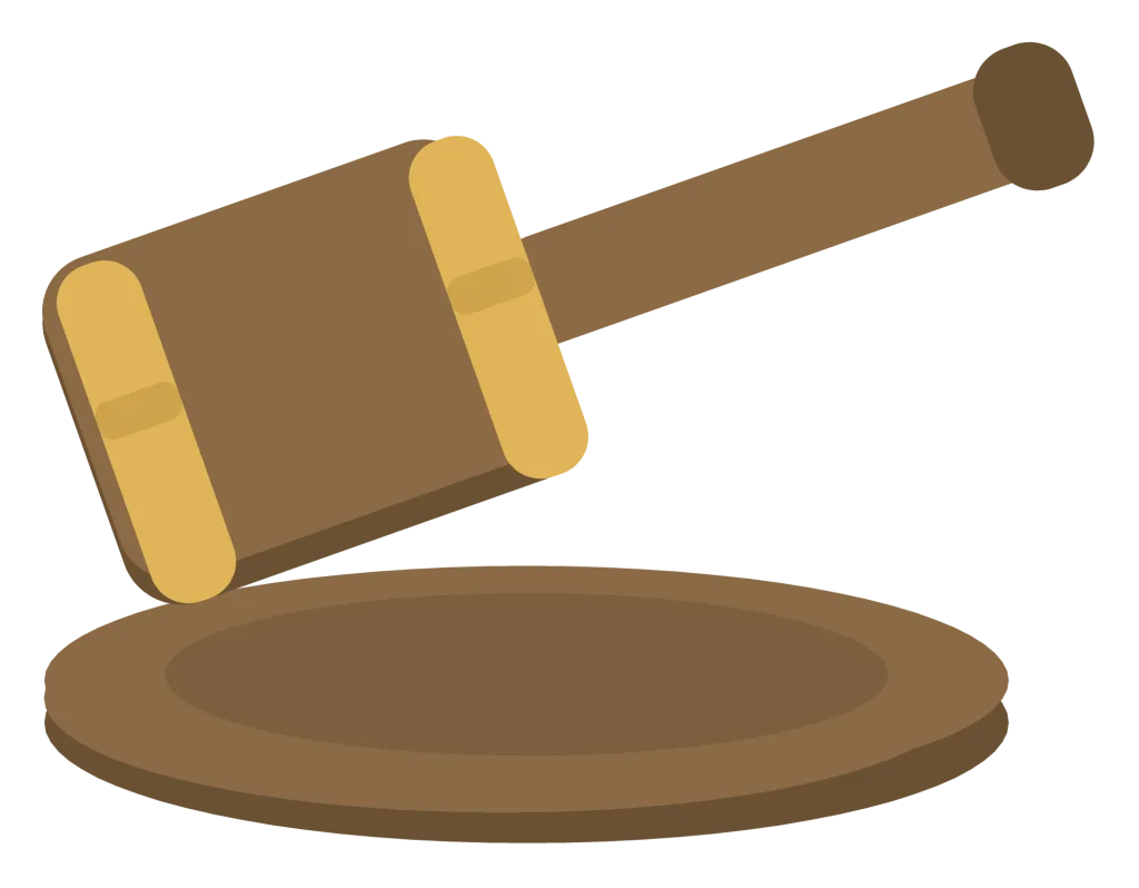 A wooden gavel resting on its round sound block, with brass bands at both ends of the head.