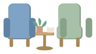 Two armchairs facing each other across a small table with a plant and a box of tissues.